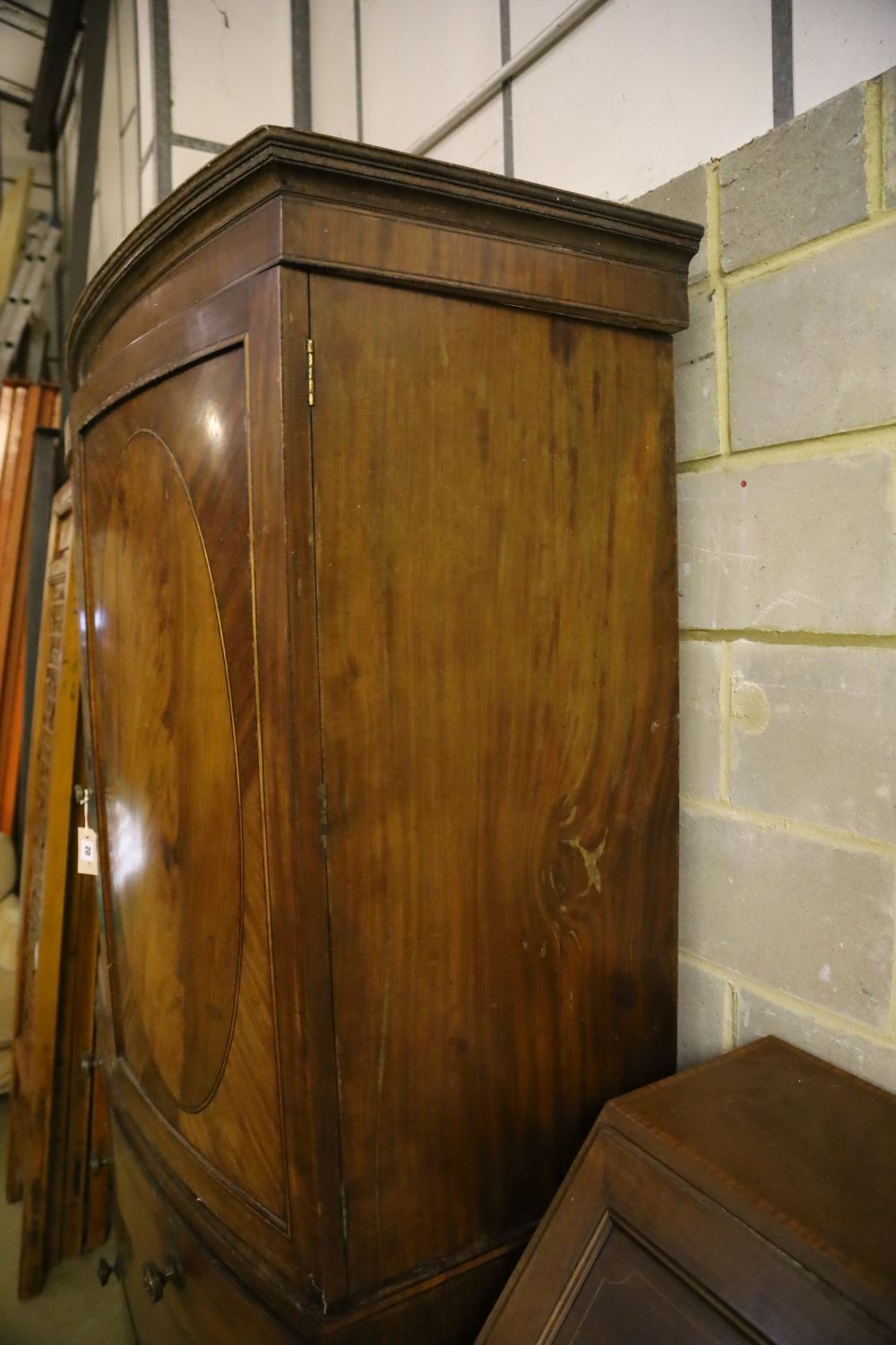 A Regency mahogany bow front linen press, width 128cm, depth 54cm, height 206cm